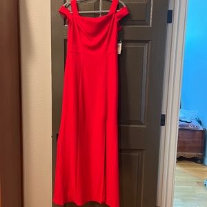 Stunning new with tags red evening gown with slit